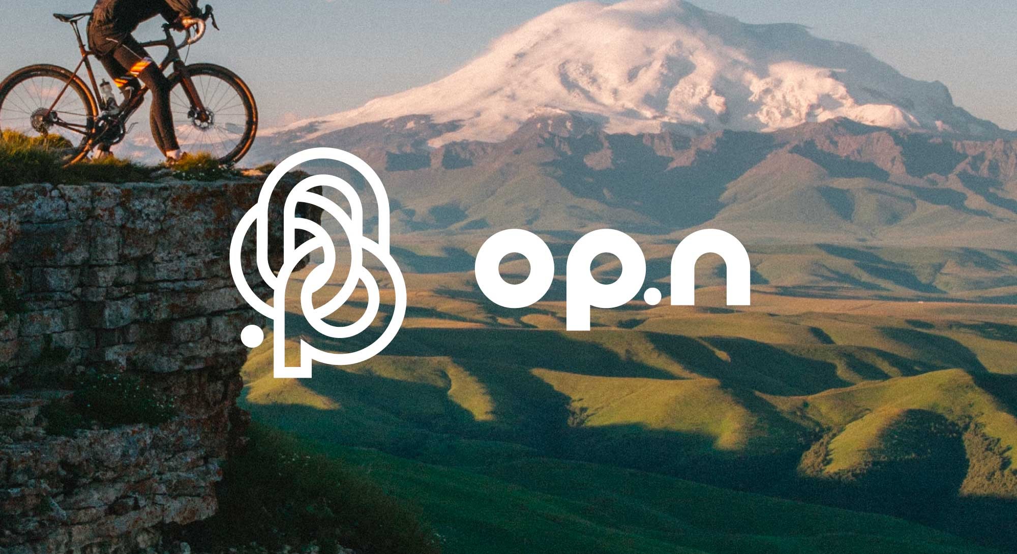 Logo de l'entreprise OP.n blanc sur photographie couleur de paysage montagneux, réalisé par ÈS.B Studio.